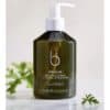Bamford Geranium Hand & Body Wash i en grön flaska med pump.
